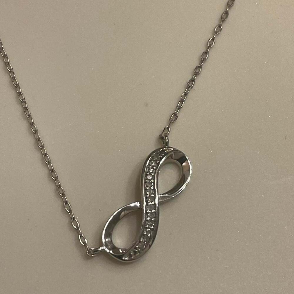 Silver infinity necklace with natural diamonds 0.05CTTW